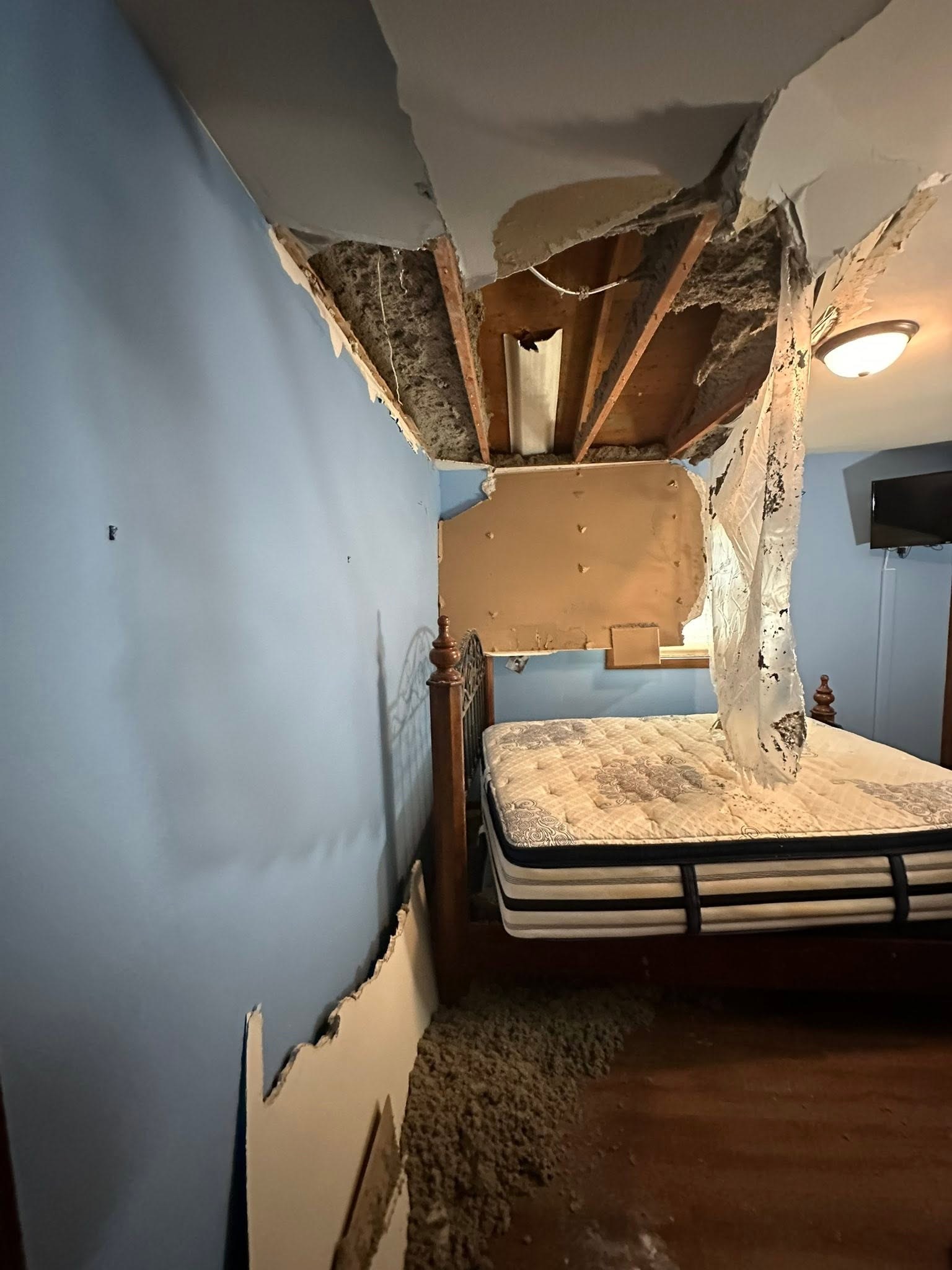 A small hole in textured drywall