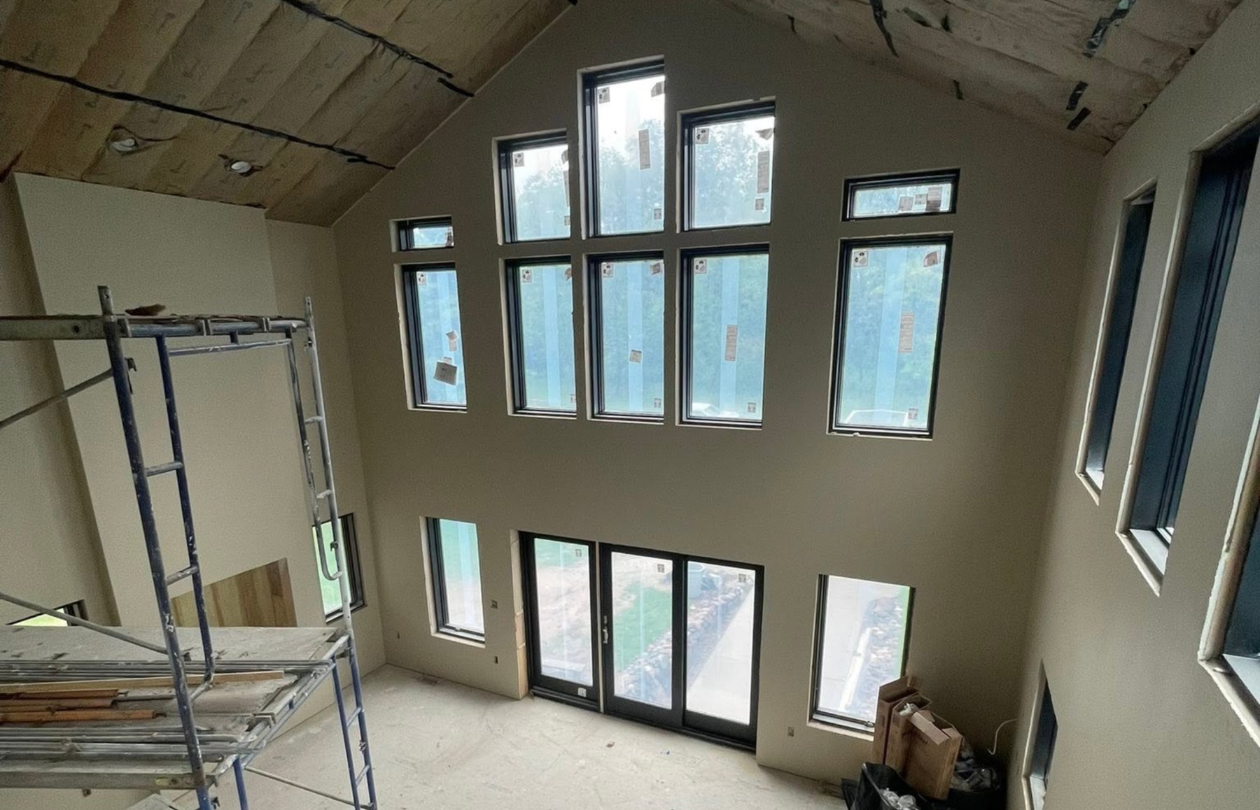 Completed great room after drywall installation and finishing